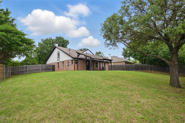 view of yard with a fenced backyard