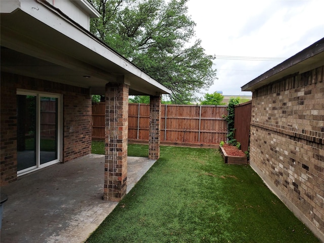 view of yard featuring a patio and fence