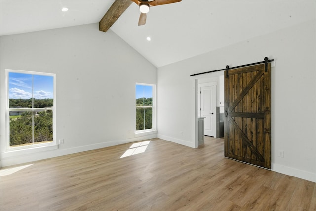 interior space with light wood-style floors, high vaulted ceiling, beamed ceiling, and a ceiling fan