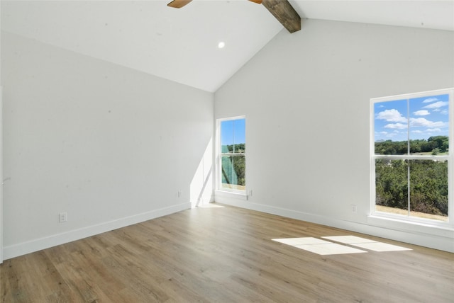 spare room with wood finished floors, ceiling fan, beam ceiling, and high vaulted ceiling