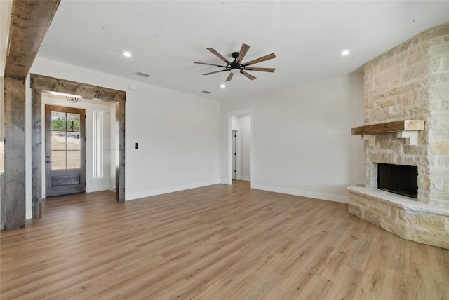 unfurnished living room with visible vents, a fireplace, light wood-type flooring, recessed lighting, and a ceiling fan
