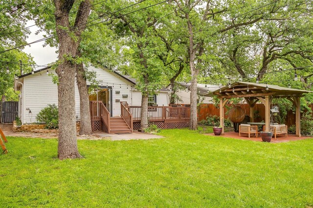 view of yard featuring a gazebo, a patio area, fence private yard, and a deck