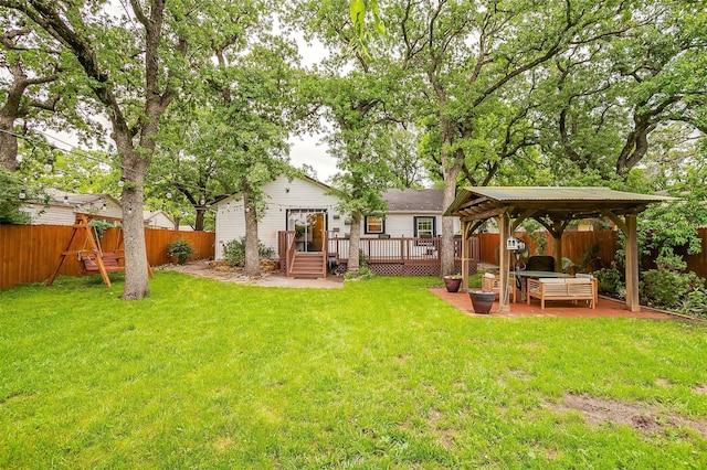 view of yard with a deck, a patio area, a gazebo, a fenced backyard, and outdoor lounge area