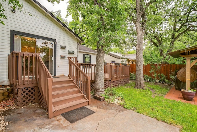 exterior space featuring fence, a patio, and a deck