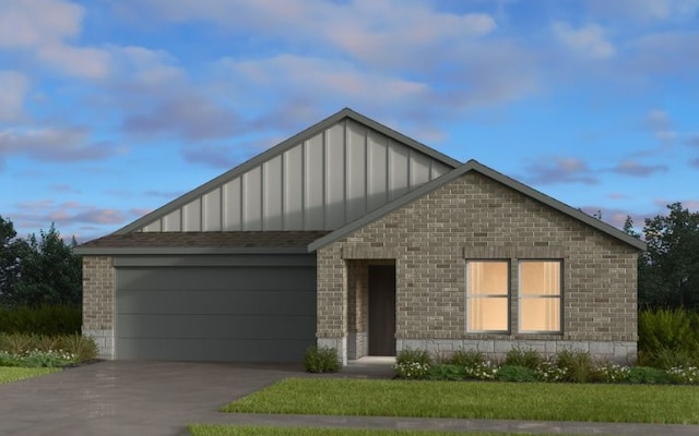 view of front of property with board and batten siding, brick siding, concrete driveway, and a garage