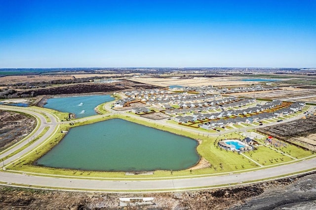 drone / aerial view with a water view and a residential view