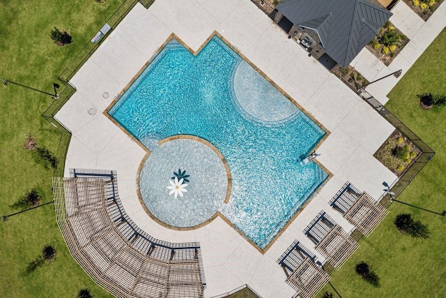 community pool featuring a yard