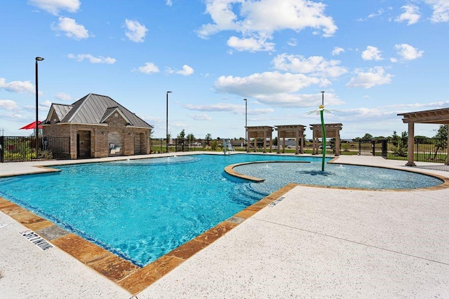 community pool with fence, a patio, and a pergola