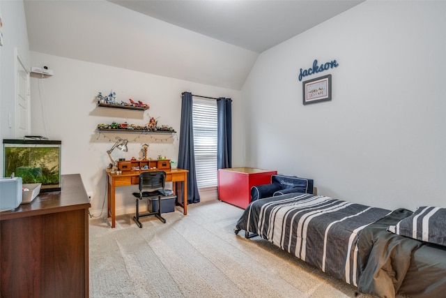 bedroom featuring light carpet and lofted ceiling