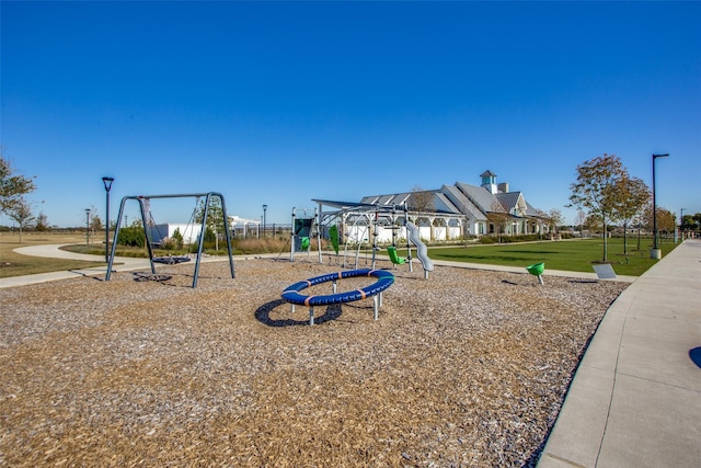 community playground featuring a yard