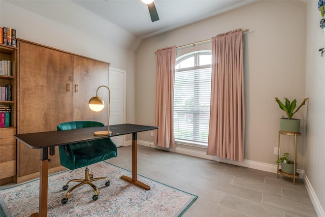 home office with baseboards and ceiling fan