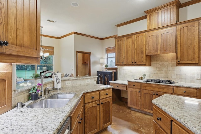 kitchen featuring light stone counters, a sink, decorative backsplash, gas stovetop, and ornamental molding