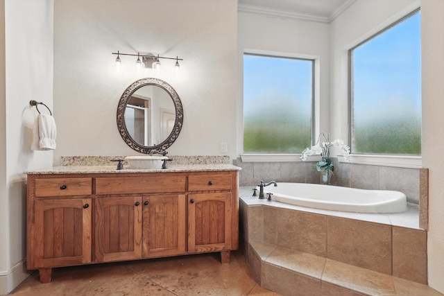 bathroom with crown molding, plenty of natural light, and a bath