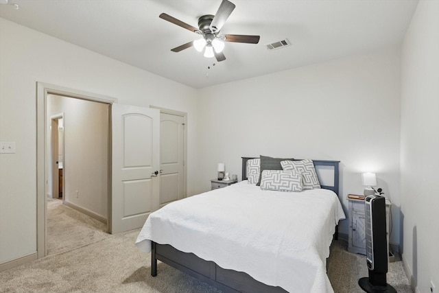 bedroom with visible vents, carpet flooring, baseboards, and ceiling fan