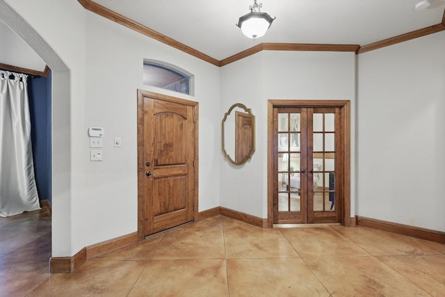 entrance foyer with french doors, concrete floors, and baseboards