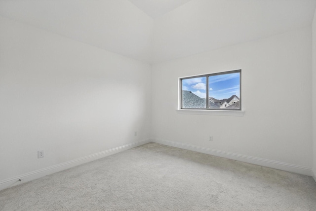 spare room with carpet flooring and baseboards