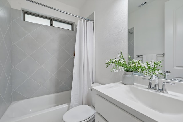 bathroom with visible vents, vanity, toilet, a textured wall, and shower / bathtub combination with curtain