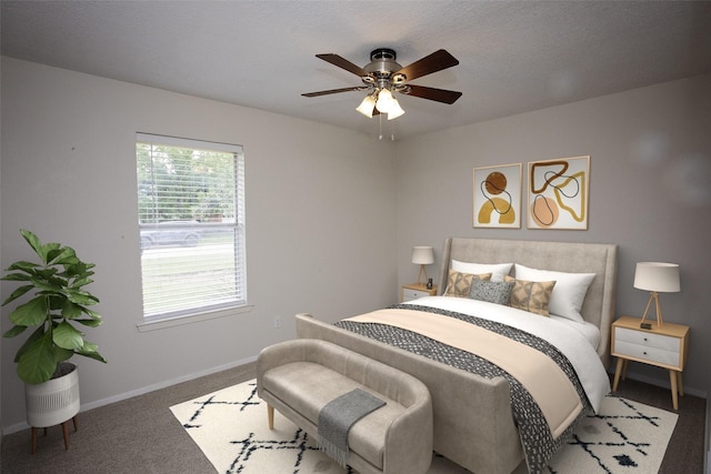 bedroom with baseboards, a ceiling fan, and carpet floors