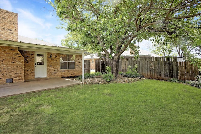 view of yard featuring a patio and fence