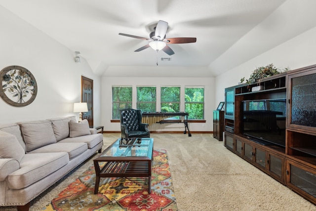 carpeted living area featuring baseboards, a ceiling fan, lofted ceiling, and visible vents