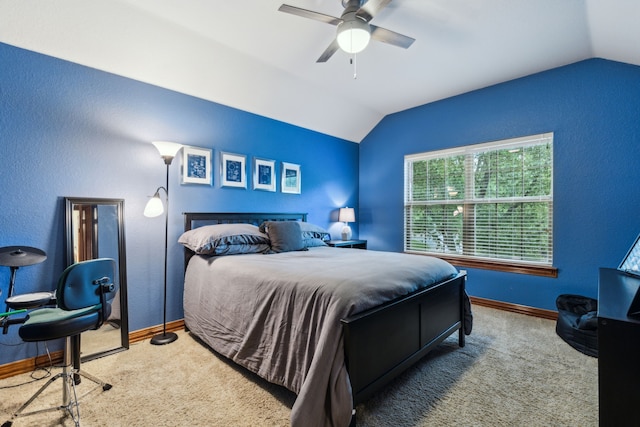 carpeted bedroom with baseboards, a ceiling fan, a textured wall, and lofted ceiling
