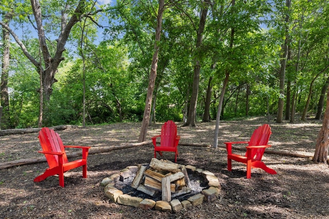 view of play area featuring an outdoor fire pit