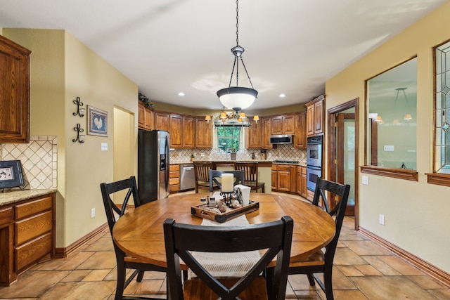 dining area with recessed lighting and baseboards