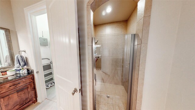 bathroom with vanity and a shower stall