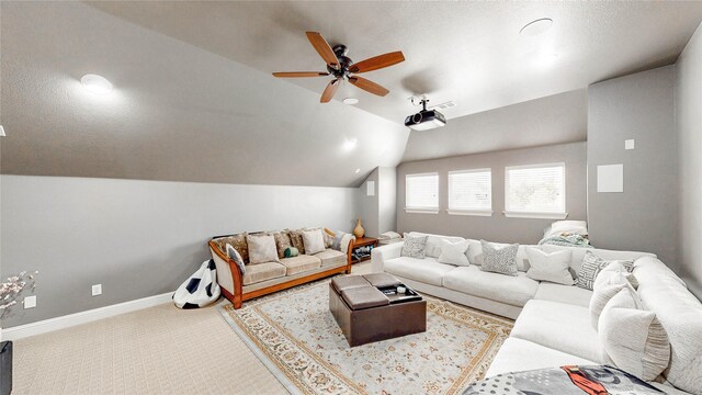 carpeted living room featuring baseboards, ceiling fan, and lofted ceiling