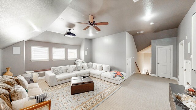 living room featuring a ceiling fan, baseboards, and lofted ceiling