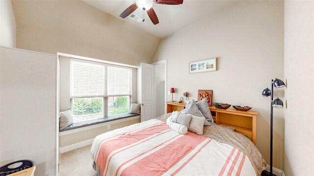 bedroom featuring visible vents, lofted ceiling, baseboards, ceiling fan, and carpet
