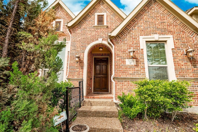 entrance to property with brick siding