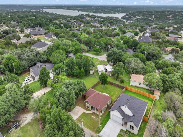 drone / aerial view featuring a residential view and a water view