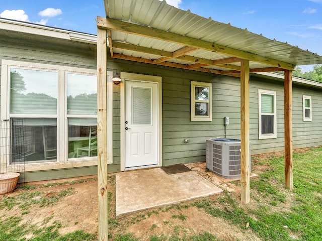 entrance to property featuring cooling unit