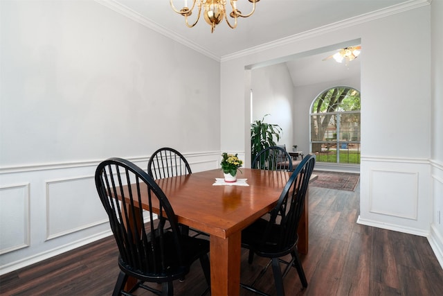 dining space with a decorative wall, a chandelier, dark wood finished floors, a wainscoted wall, and ornamental molding