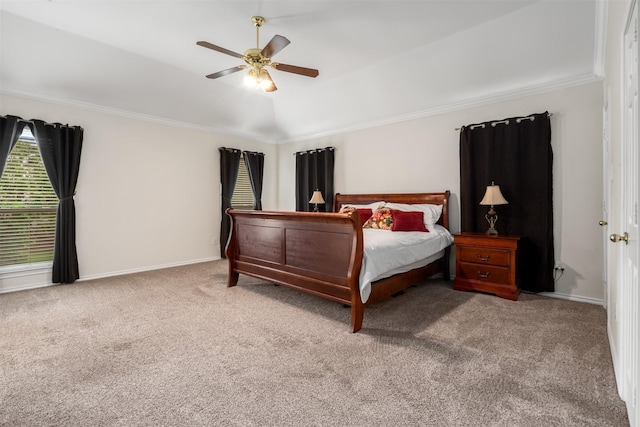 carpeted bedroom featuring a ceiling fan, baseboards, and ornamental molding