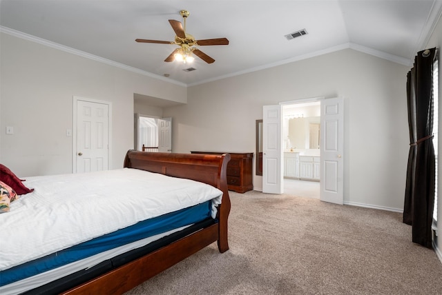 bedroom featuring visible vents, baseboards, ornamental molding, light carpet, and ensuite bath