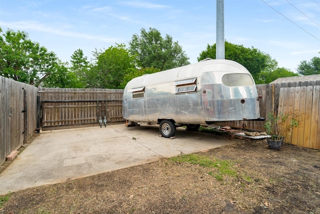 view of vehicle parking featuring a fenced backyard