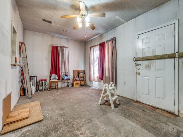 4942 Terry St, Dallas, TX 75223 - interior space with a textured ceiling, ceiling fan, and visible vents