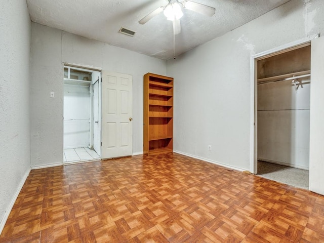 4942 Terry St, Dallas, TX 75223 - unfurnished bedroom with visible vents, a closet, baseboards, ceiling fan, and a textured ceiling