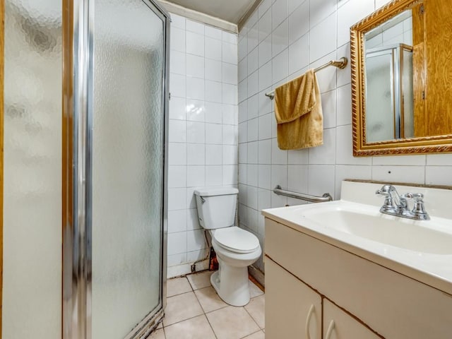 4942 Terry St, Dallas, TX 75223 - bathroom with vanity, tile patterned floors, a stall shower, and tile walls