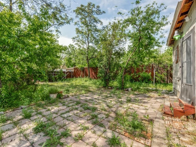 4942 Terry St, Dallas, TX 75223 - view of yard featuring a fenced backyard and a patio area