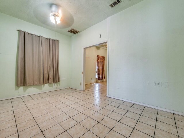 4942 Terry St, Dallas, TX 75223 - empty room with ceiling fan, visible vents, and light tile patterned floors