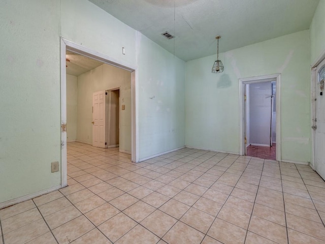 4942 Terry St, Dallas, TX 75223 - spare room with visible vents and light tile patterned flooring