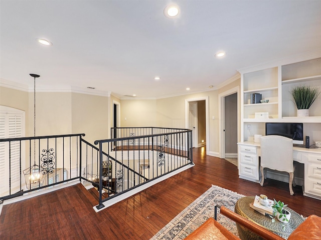 office featuring built in desk, recessed lighting, dark wood finished floors, ornamental molding, and baseboards