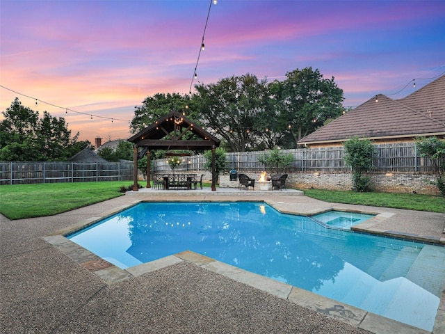 view of pool featuring a gazebo, a fire pit, a patio area, and a pool with connected hot tub