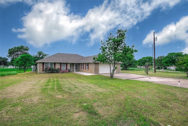ranch-style house with brick siding, an attached garage, a front yard, and concrete driveway