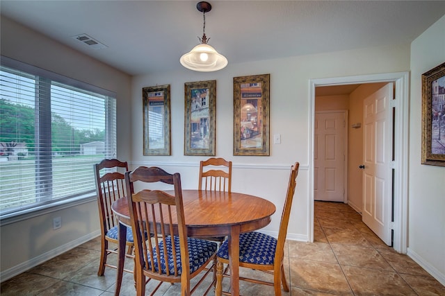 dining space with visible vents, baseboards, and light tile patterned flooring