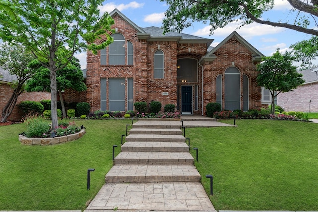 1909 Sagebrush Trl, Richardson, TX 75080 - traditional home with a front lawn and brick siding