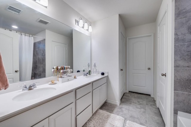 1016 Webb Ave, Aubrey, TX 76227 - full bath featuring visible vents, a sink, and double vanity